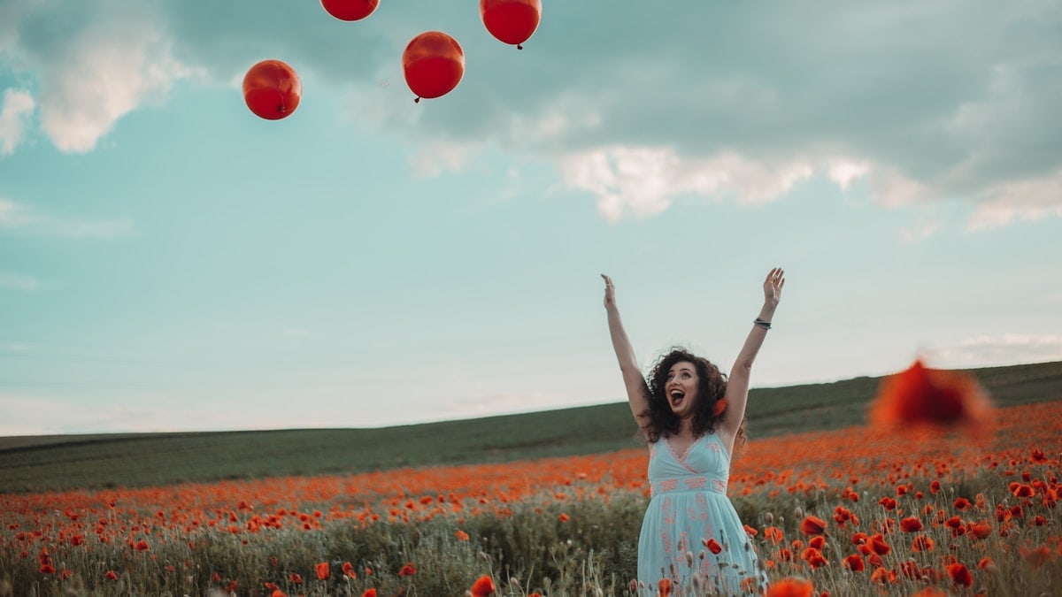A moment of happiness in a field of poppies